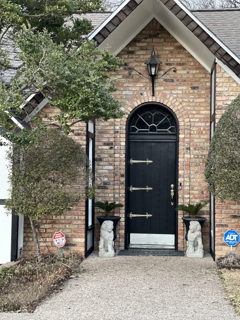 large black decorative door with glass on top 